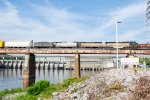 A southbound intermodal slides past a manifest stopped on the Tennbridge